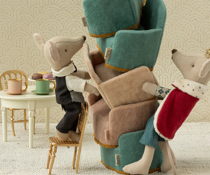 maileg king mouse with Stack of plush chairs with animal figures on a neutral background