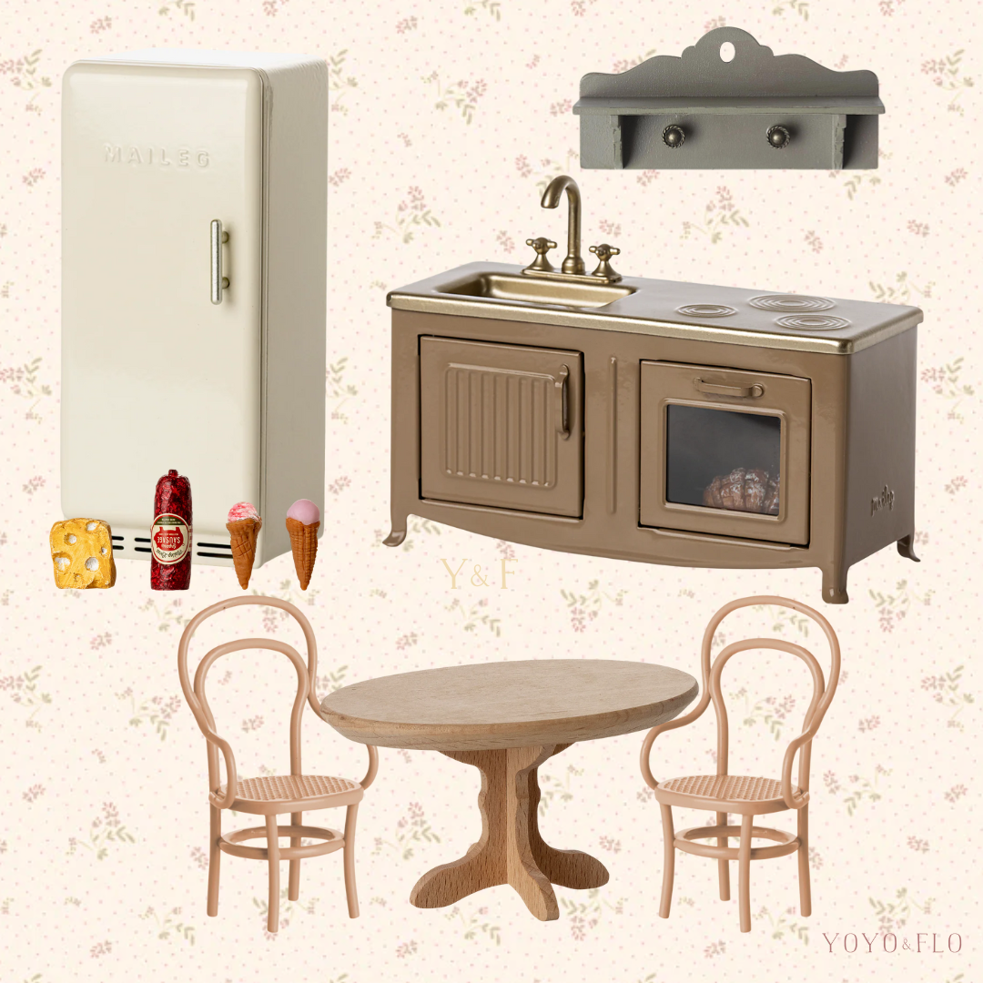 Collage of miniature kitchen furniture including a refrigerator, sink, stove, table, and chairs on a floral wallpaper background.