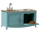 Teal toy kitchen set with sink and stove on a white background
