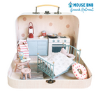 Miniature dollhouse setup inside a suitcase with 'Mouse BNB Beach Retreat' branding.