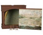 A decorative fireplace mantel display set featuring a brown faux-brick fireplace insert with patterned green and gold damask wallpaper lining, a matching landscape art print depicting swans on water, and three brass candlesticks.