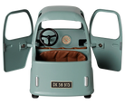 A vintage-style children's ride-on toy car in a muted sage green color, featuring open doors, a black steering wheel, a brown leatherette seat, and a license plate reading 'DK 56 915'.