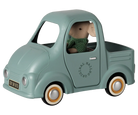 A mint green toy pickup truck with a plush mouse driver wearing a green knit sweater. The toy truck features vintage-style wheels with tan rims, a black license plate, and 'ORIGINAL MASHUP' branding printed on the side door.