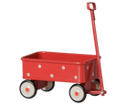 A classic red metal toy wagon with white polka dots, cream-colored wheels with black trim, and a red D-handle, shown against a plain white background.