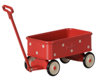 A red metal toy wagon with white polka dots, cream-colored wheels with black rims, and a red handle, shown on a plain white background.