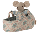 Stuffed mouse toy in a floral-patterned crib on a white background
