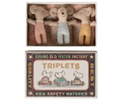 Three toy mice in a matchbox with a vintage-style matchbox label.