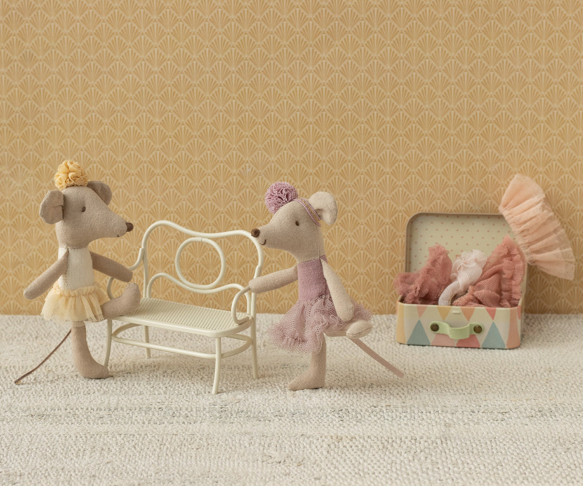 maileg ballerina Two toy mice with a chair and box on a textured surface with patterned wall background