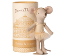 Stuffed mouse doll in a tutu dress next to a cylindrical box with decorative design and text.