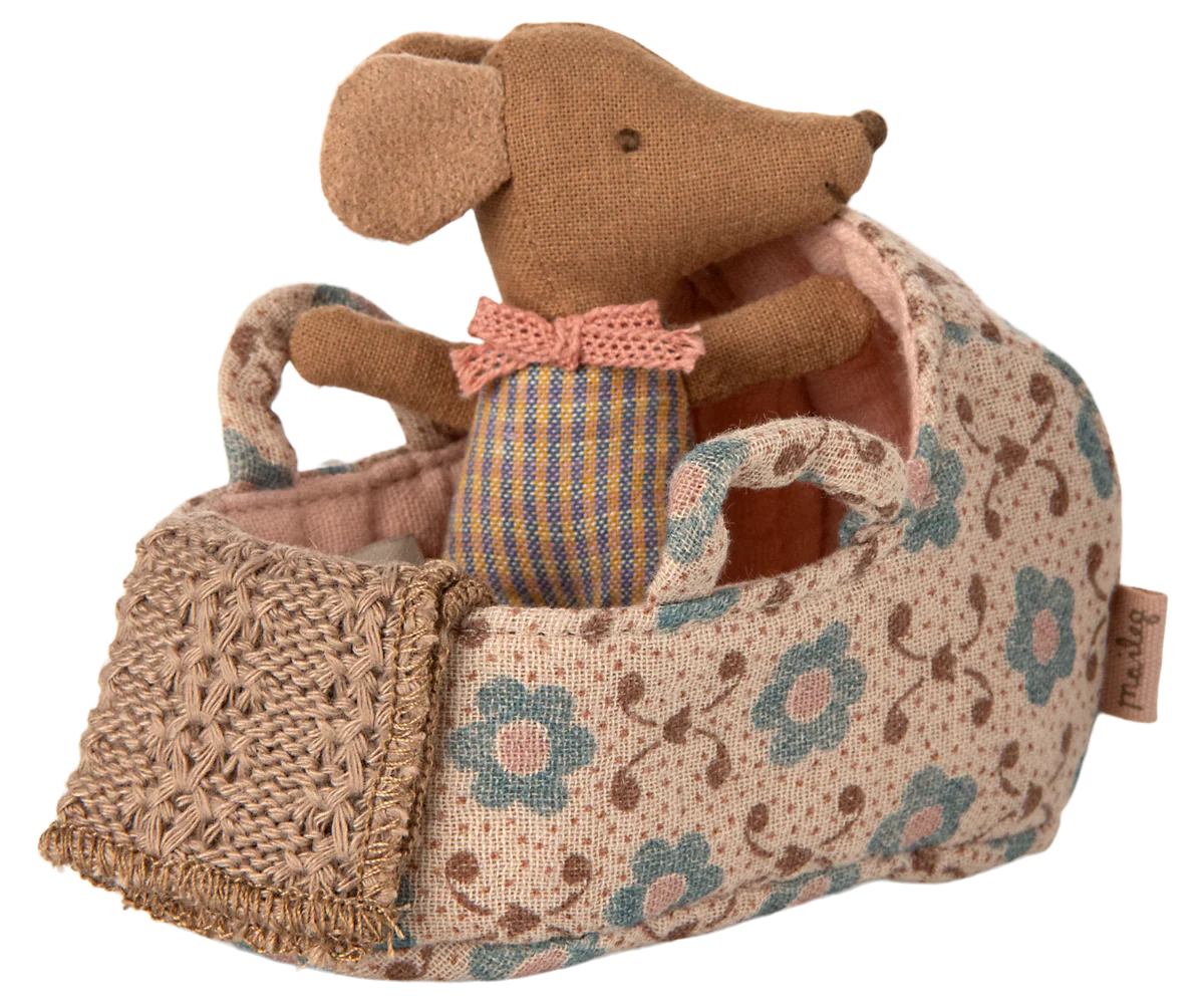 Stuffed mouse toy with a floral-patterned bag on a white background
