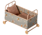 Maileg mouse cot bed with floral pattern and wooden wheels on a white background