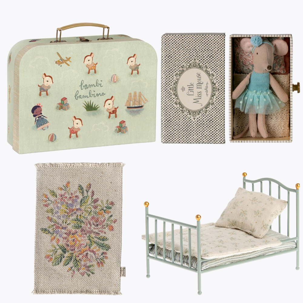 Collection of children's bedroom items including a suitcase, bed, and decorative elements on a white background.
