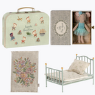 Collection of children's bedroom items including a suitcase, bed, and decorative elements on a white background.