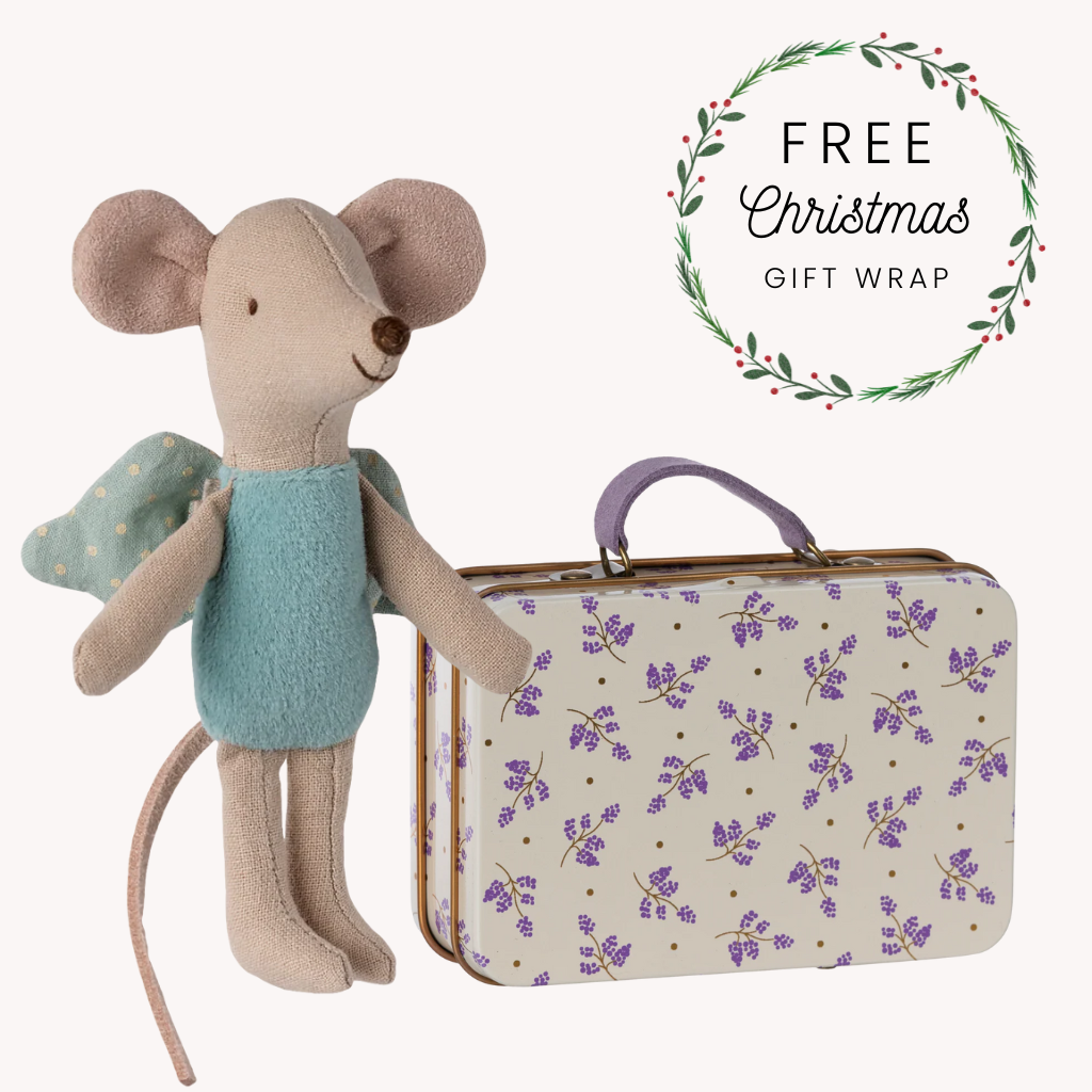 Stuffed mouse toy with a suitcase featuring a floral pattern, with text about free Christmas gift wrap.
