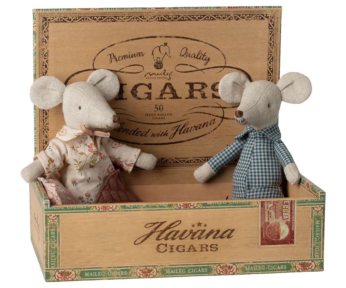 Two toy mice in a decorative cigar box with  Maileg branding.