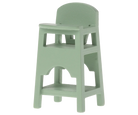 A small, mint green high chair designed for doll house figures, specifically baby mice and My rabbits.