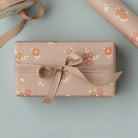 Maileg michette wrapping paper with floral design on a light blue background