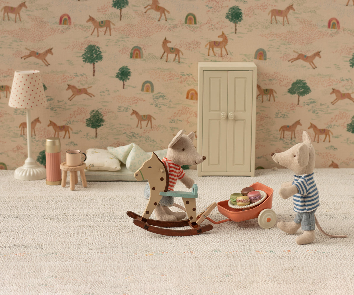 maileg mouse room with toys and a patterned wallpaper and rocking horse