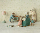 maileg mice sitting in a living room watching television