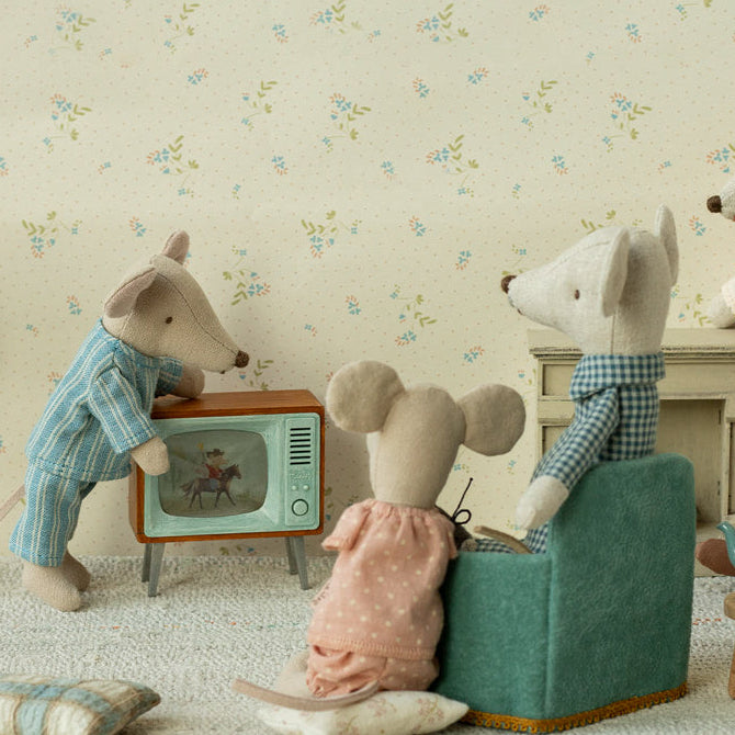 maileg mice sitting in a living room watching television