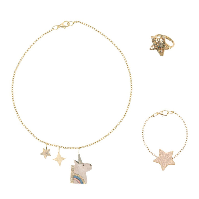 Jewelry set with gold unicorn necklace, ring, and bracelet on a white background