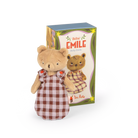 Moulin Roty Emile Plush toy bear in a checkered dress with packaging in the background