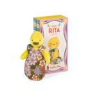 Moulin roty baby rita duck Yellow plush toy with a floral dress next to its packaging on a white background