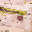 Close-up of a pink childrens backpack with a strawberry-shaped zipper pull and floral pattern.