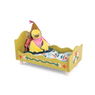 Yellow toy duck in a bed with a floral pattern on a white background