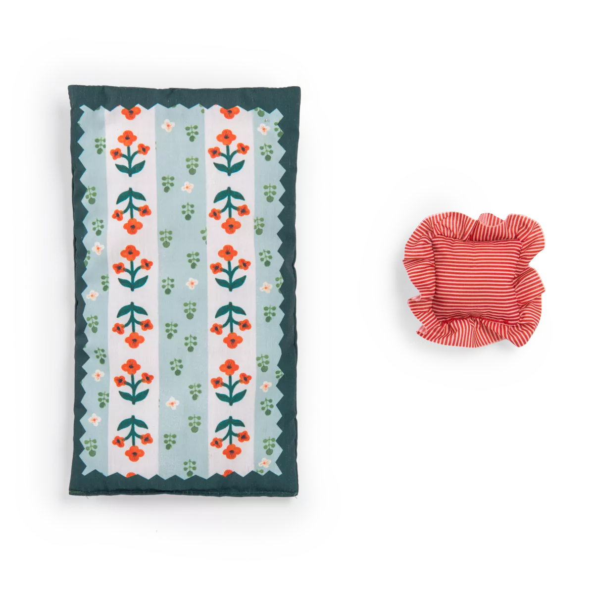 Floral-patterned pillow and red striped bowl on a white background