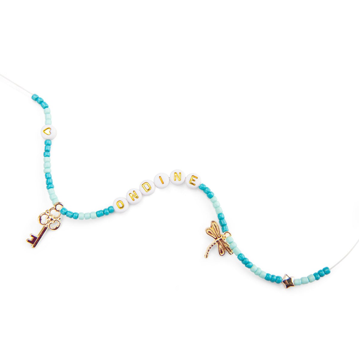 A beaded necklace with turquoise and light blue beads, white letter beads spelling 'ORDINE', gold-tone key and dragonfly charms, and a small gold heart bead on a white background.