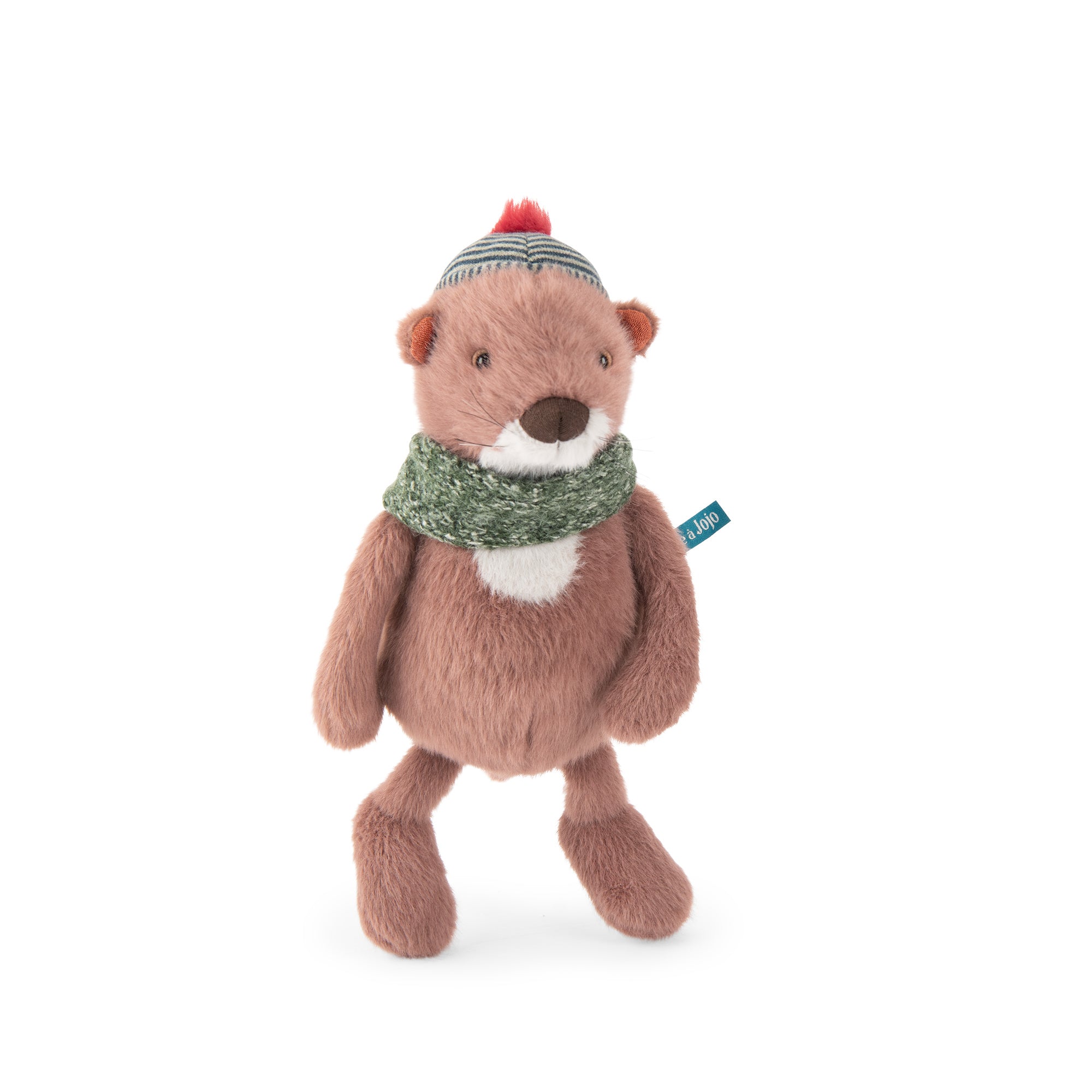 A plush toy otter wearing a green knit scarf and a striped beanie with a red pom-pom, standing against a plain white background.