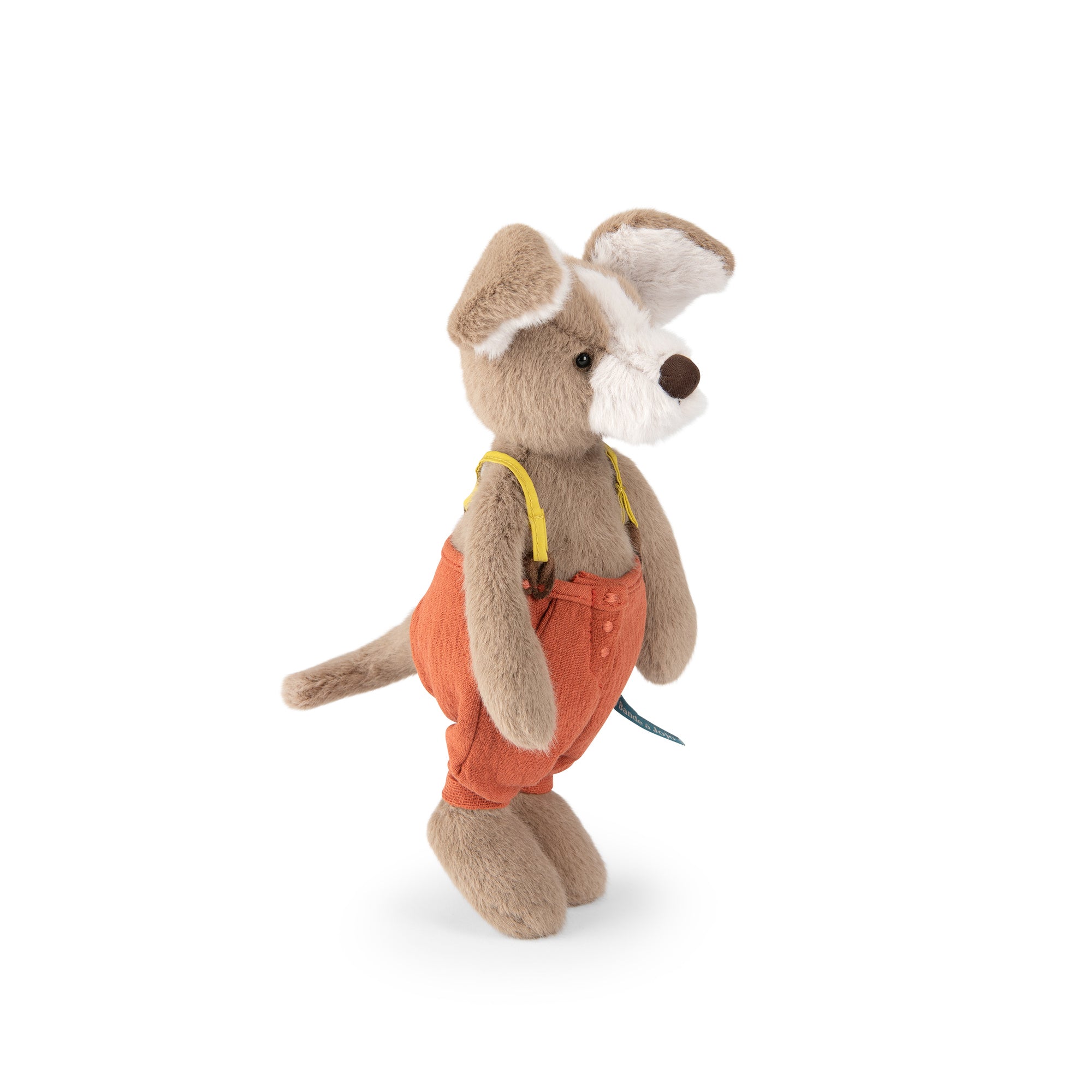 A plush dog toy wearing orange overalls with yellow suspenders, standing against a plain white background.