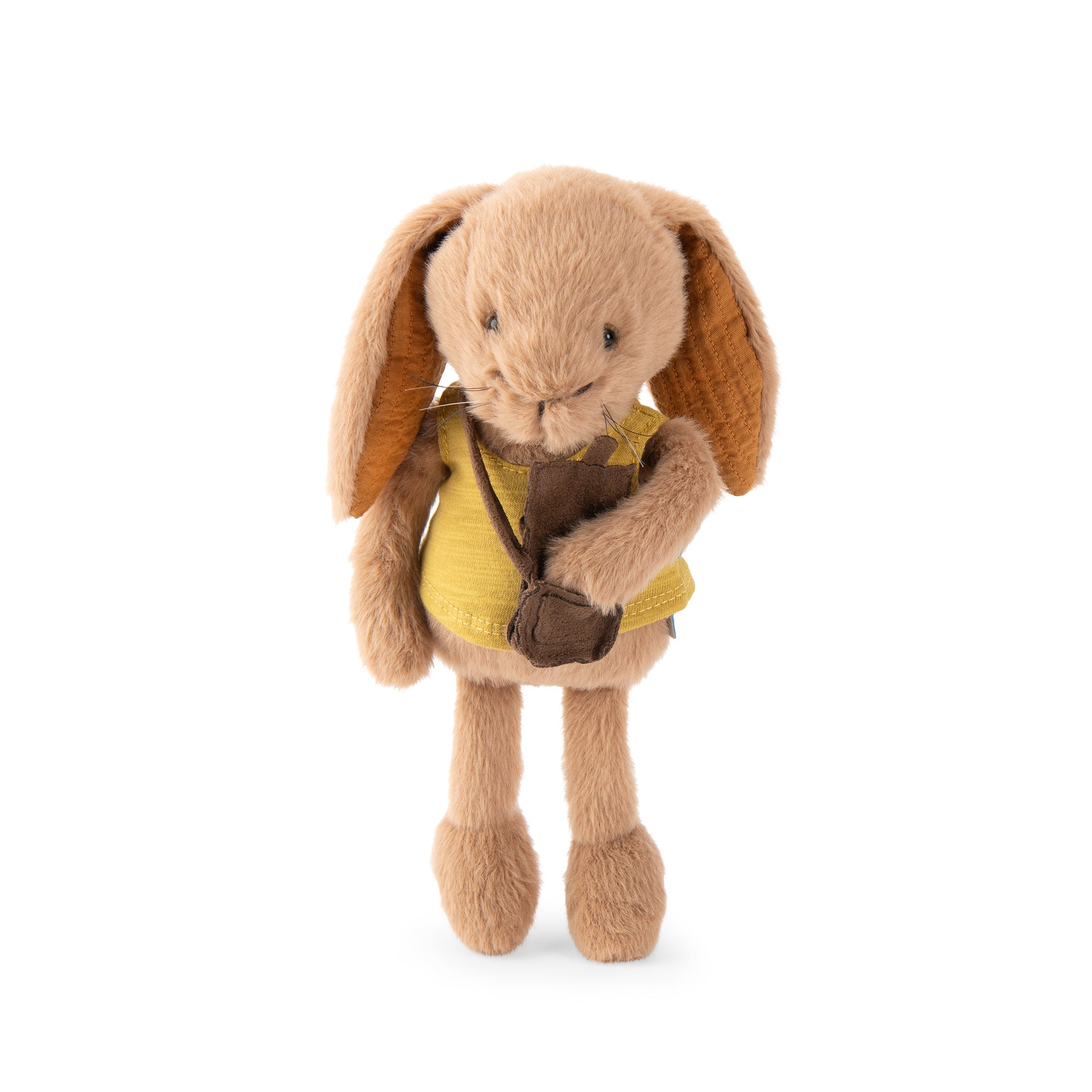 A plush toy rabbit standing against a plain white background. The rabbit is light tan with long floppy ears, holding a small brown camera and wearing a yellow vest.