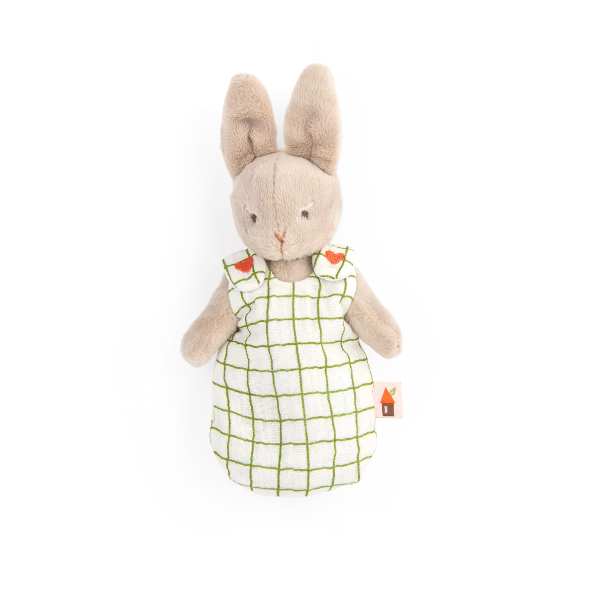 Stuffed rabbit toy wearing a white dress with green grid pattern on a white background