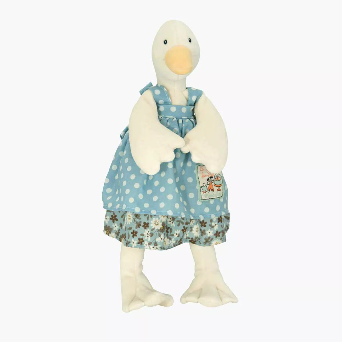 Stuffed duck toy wearing a blue dress with floral patterns on a white background