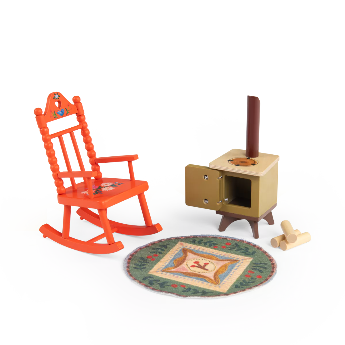 miniature Wooden rocking chair, stove, rug, and logs on a white background