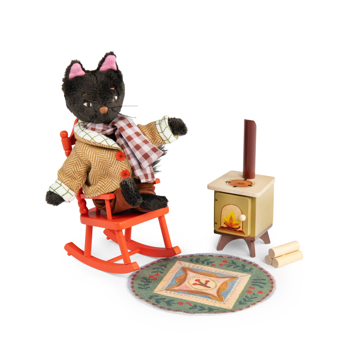 Toy black cat in a sweater sitting on a rocking chair next to a small stove with a fire.