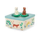 Toy music box with animal figures on a white background