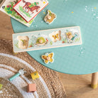 Children's educational puzzle with animal illustrations on a green table