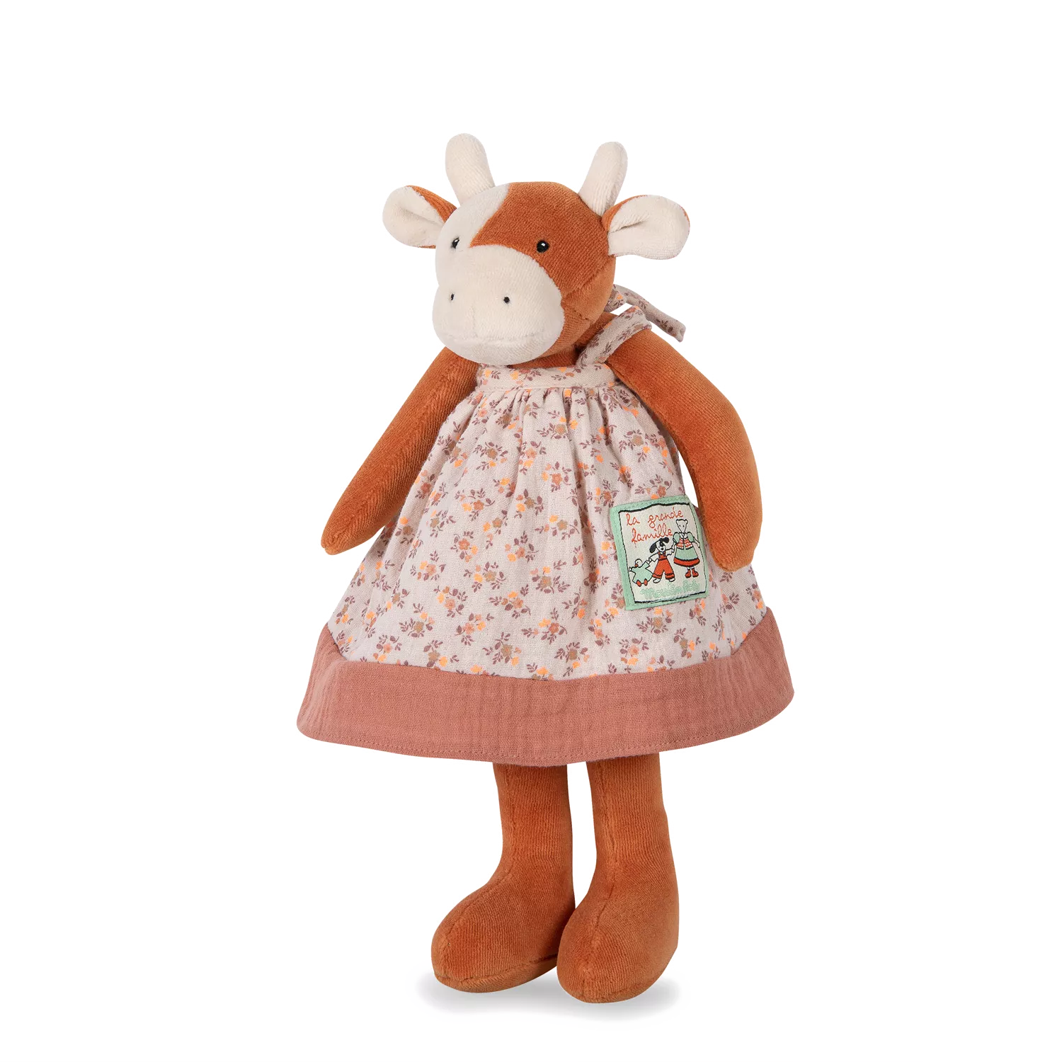Plush cow toy with a dress on a white background