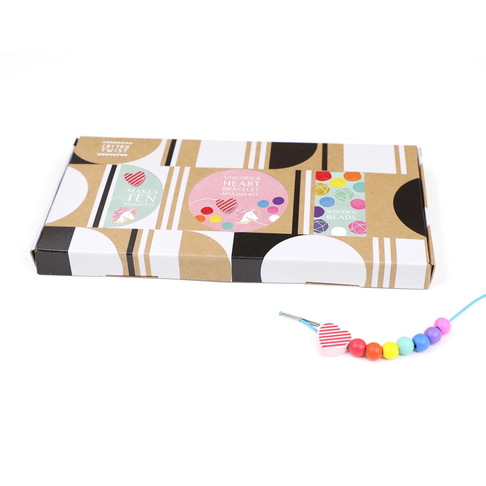 Colorful beaded necklace in front of a patterned box on a white background