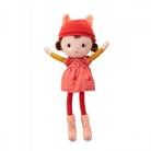 Stuffed toy with a red hat and dress on a white background