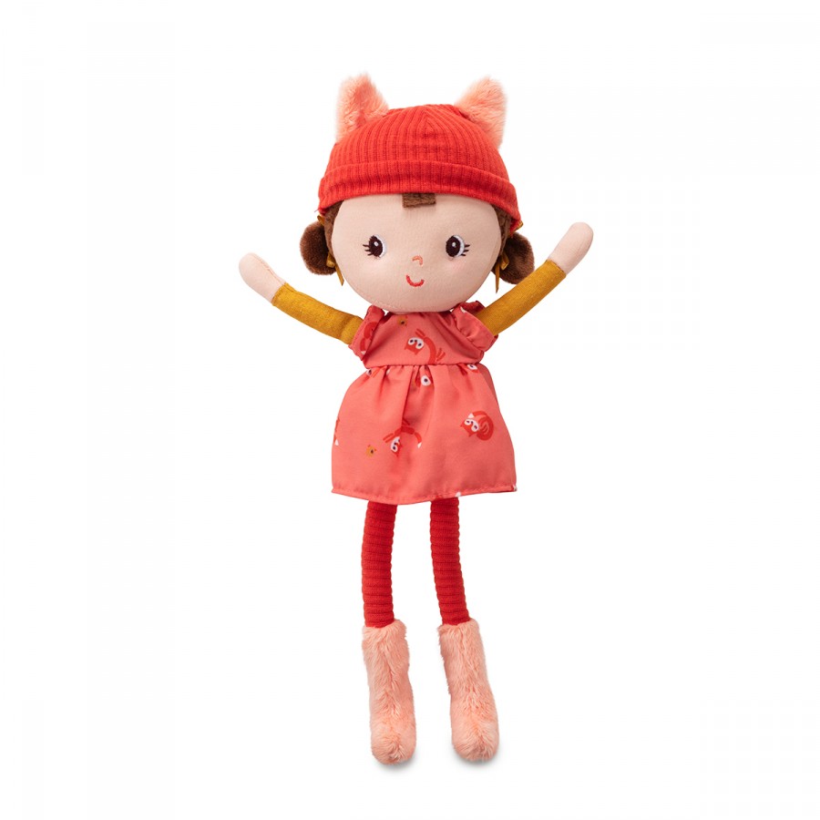 Stuffed toy with a red hat and dress on a white background