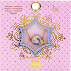 Bracelet in a decorative box on a pink background with 'Luz' branding