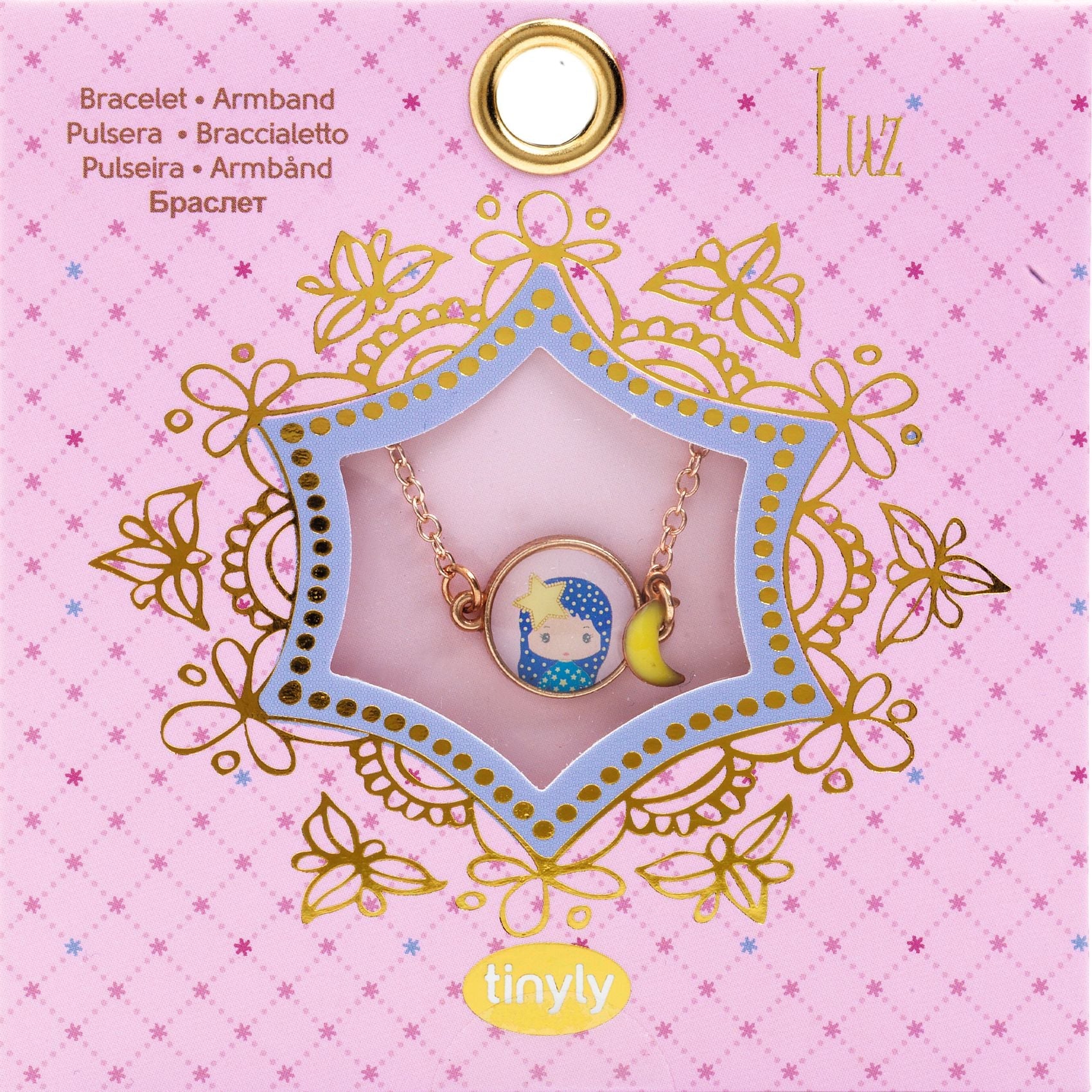 Bracelet in a decorative box on a pink background with 'Luz' branding