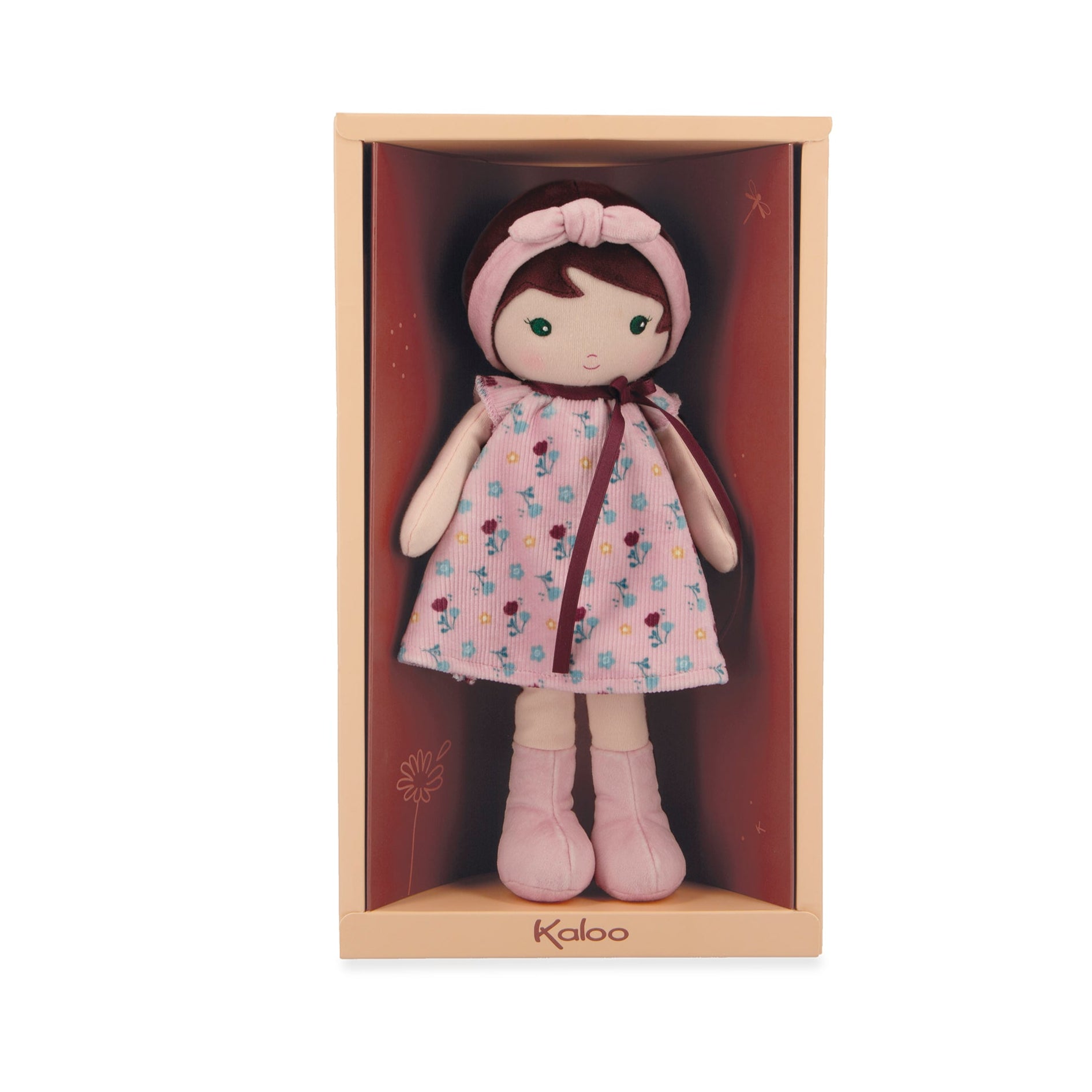 Doll in a pink floral dress and bonnet in a wooden box with 'Kaloo' branding.
