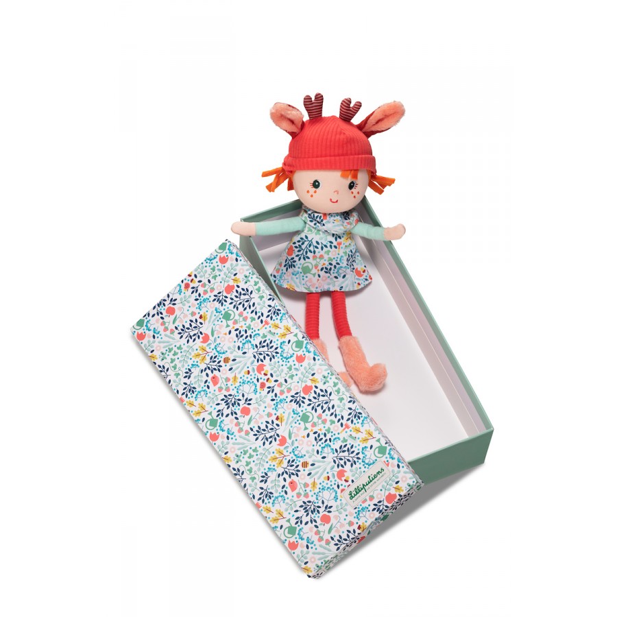 soft Toy doll with a red hat and floral dress in a patterned box on a white background