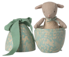 Stuffed animal toy in a decorative box with a matching bag on a white background
