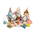 Set of plush toys and accessories on a colorful quilt with a white background